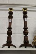 A good pair of turned wood candlesticks.