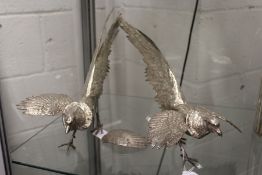 A pair of plated pheasants.