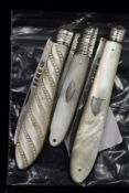 Three silver and mother-of-pearl fruit knives.