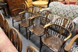 A SET OF FOUR 19TH CENTURY ASH AND ELM LOW BACK WINDSOR ARMCHAIRS. 2ft 11ins high x 1ft 9ins wide.