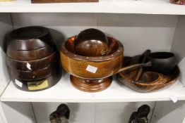 A turned wood nut bowl, a carved wood bowl and other wooden items.