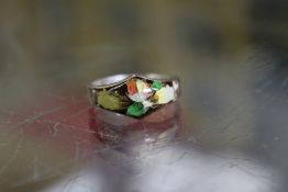 A silver and enamel ring.