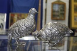A pair of plated models of game birds.