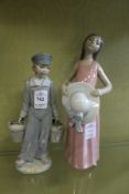 Two Lladro figures of a young Dutch boy holding milk pails together with a young woman holding a