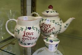 An Emma Bridgewater teapot and matching jug and similar item.