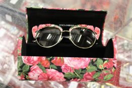 A pair of Dolce and Gabbana sunglasses.