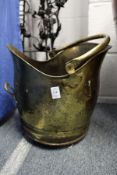 A brass coal scuttle.