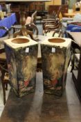 A pair of decorative pottery stands.