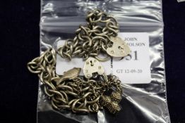 Silver bracelets with padlock clasps.