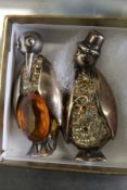 Two novelty penguin brooches.
