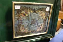 A 19th century floral and metal thread embroidered textile, framed and glazed.