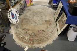 A Chinese oval carpet.