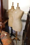 Two Victorian dressmaker's mannequins on tripod bases.