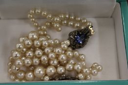 Pearl necklaces with marcasite clasps.