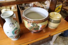 An oriental vase, a jardiniere and biscuit barrel and cover.