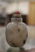 A Chinese hardstone snuff bottle.
