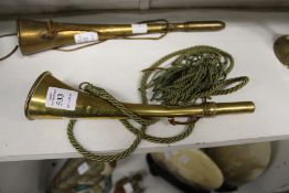 A brass hunting horn.