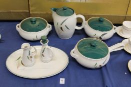 A small group of Denby Green Wheat china.