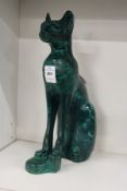 A carved malachite model of a cat.