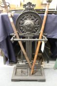 A Victorian stle cast iron stick stand.