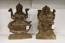 A pair of relief cast bronze models of Hindu gods.