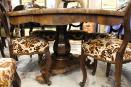 A good 19th century rosewood circular breakfast table on a baluster shaped column with circular base