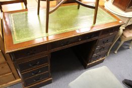 A reproduction mahogany pedestal desks.