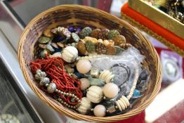 A basket containing numerous bead necklaces.
