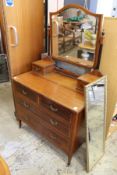 An Edwardian mahogany dressing chest.
