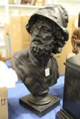 A cast spelter bust of a classical male figure.