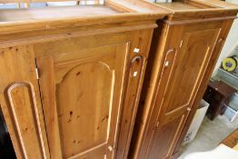 A modern pine single door wardrobe.