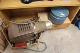 An old cine projector with film etc.