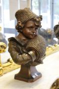 A good large continental bronze glazed pottery bust of a young girl, her hands in a muff.