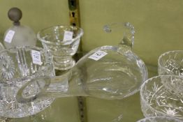 A modern glass wine pourer.