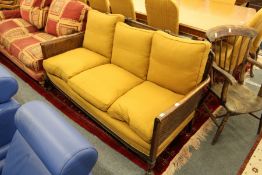 A mahogany framed Bergere three seater settee.