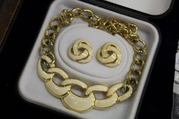 A decorative necklace and earring set.