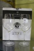 A boxed pair of Dartington crystal wine glasses.