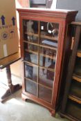 A painted single door display cabinet / bookcase.