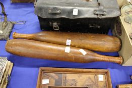 A pair of early 20th century turned wood exercise clubs.
