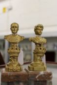 A pair of small gilt metal busts on marble bases.