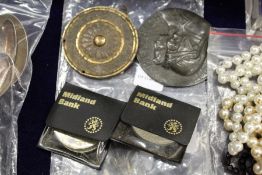 A medallion and other items.