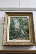 A Young Lady Reclining in a Garden oil on board, in a decorative gilt frame.