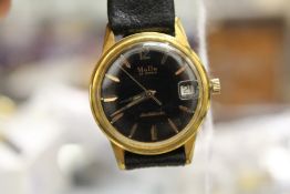 A gent's wristwatch with leather strap.