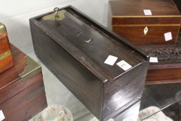 An oak candle box fitted with a lock.