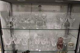 A large quantity of cut glass drinking glasses, decanters, bowls etc.