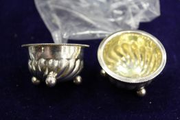 A pair of miniature silver salts.