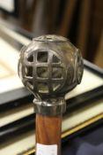 A novelty walking stick with diver's helmet handle.
