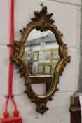 A small gilt framed mirror.