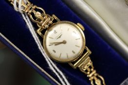 A ladies' 9ct gold Longines wristwatch.