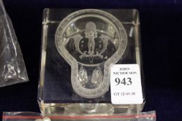 An unusual glass inkwell with intaglio carved cover.